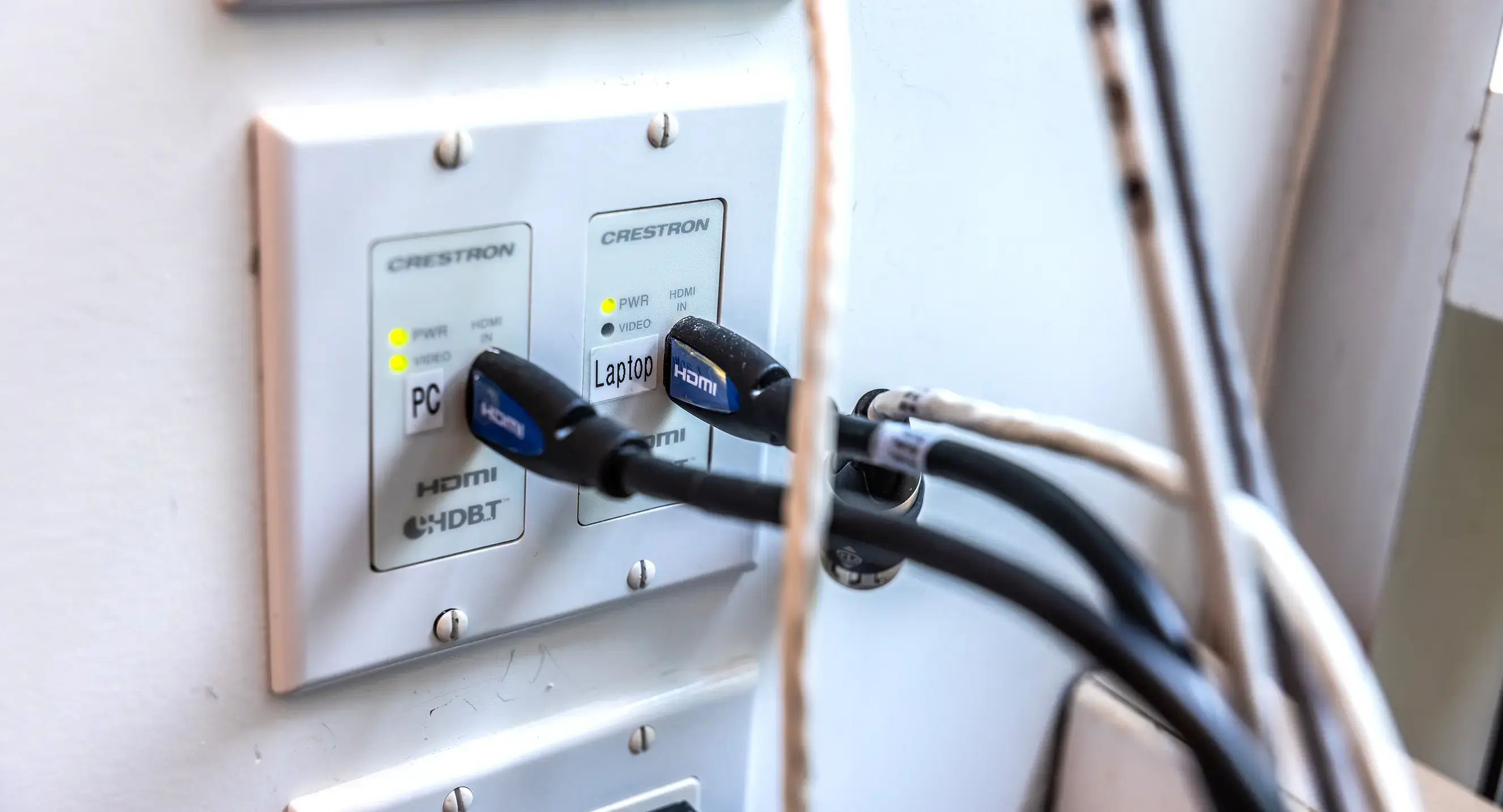 An ethernet cable plugs into a wall outlet