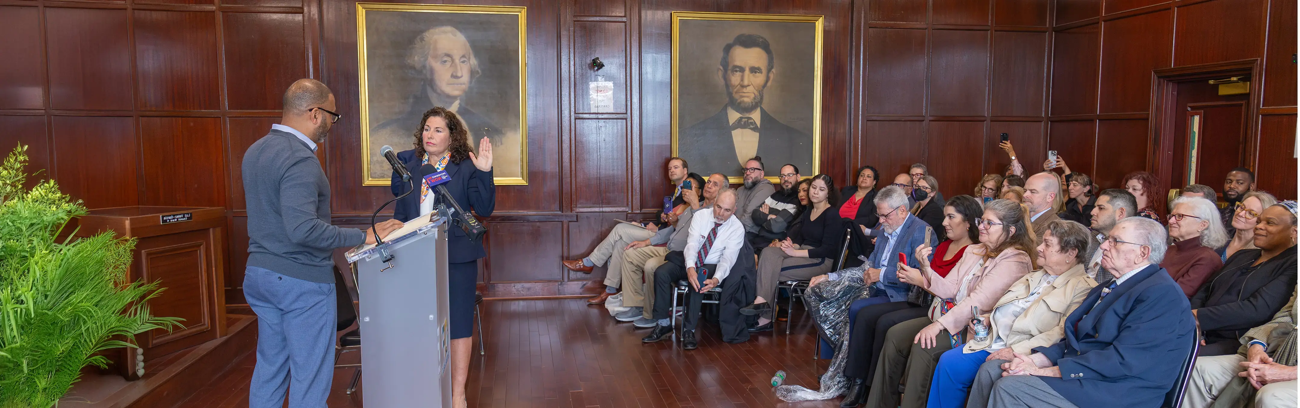 A public servant is sworn in during a courthouse ceremony