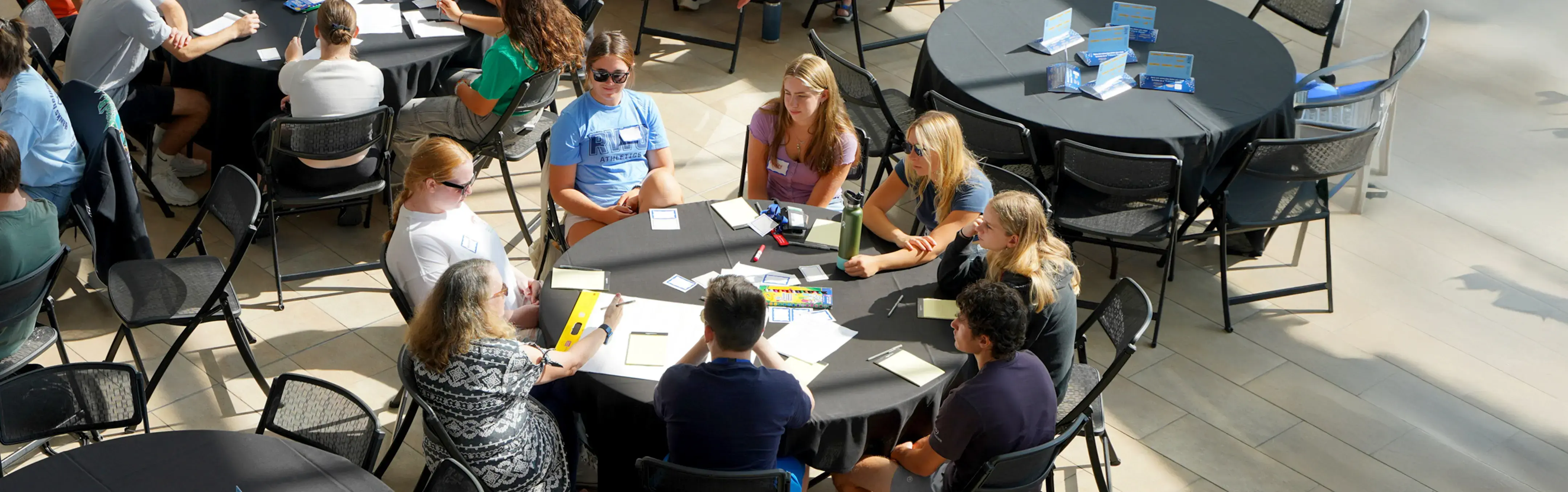 A group of students are led in a social experiment inside a well lit building