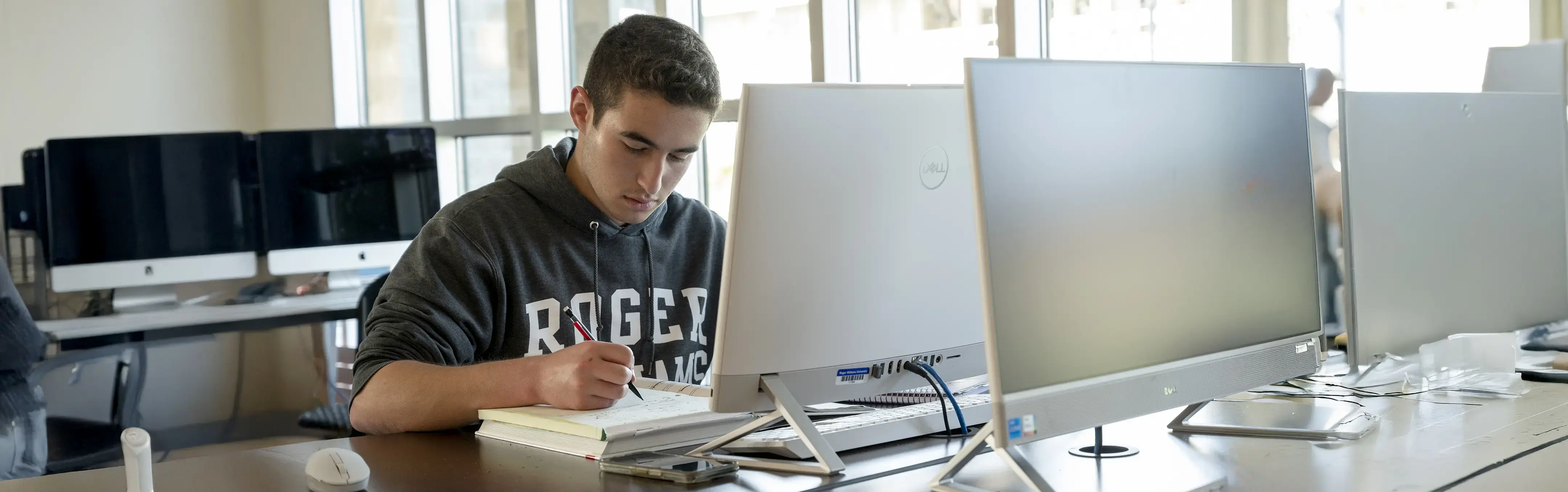 A student studies in front of a computer